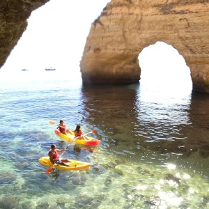 a person standing next to a body of water