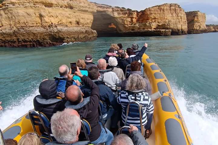 a group of people on a raft in a body of water